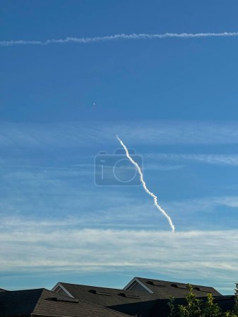 Photo for Exhaust trail from a rocket launch in Florida. - Royalty Free Image