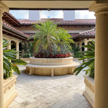 Photo for Jupiter, FL USA - May 31, 2022:  The entrance to the courtyard at the Trump National Golf Course Club House in Jupiter, Florida. - Royalty Free Image