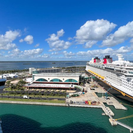 Photo for Orlando, FL USA - January 8, 2022:  The Disney Cruise line building and cruise ship Fantasy at dock in Port Canaveral, Florida. - Royalty Free Image