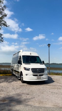 Photo for Beaufort, SC USA - February 26, 2023:  A Grech Strada RV Van parked by a river on a sunny day. - Royalty Free Image