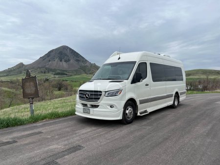 Photo for Sturgis, SD USA - May14, 2023: A Van in front of Bear Butte in Bear Butte State Park near Sturgis, South Dakota on a cloudy day. - Royalty Free Image