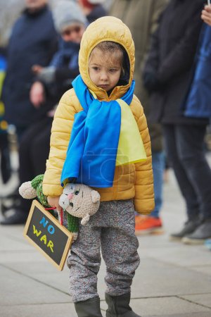Sad child at action in support of Ukraine in Denmark.