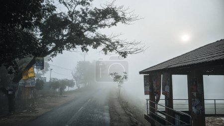 Téléchargez les photos : A Beautiful Foggy winter morning Landscape road view of at tangail, Bangladesh. - en image libre de droit