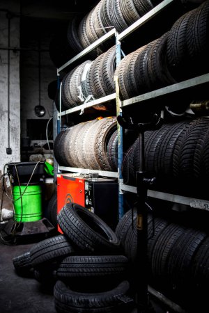 Garage. Car repair. Tools. Rubber tires, wheels. Tire service. Replacement of bulbs. Engine repair.