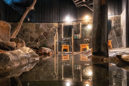 Téléchargez les photos : Beppu private bath hot springs onsen house. Famous onsen area in Beppu, Japan. Taken during winter time - en image libre de droit