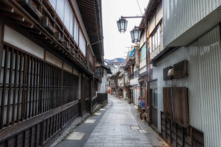 Photo for Shibu Onsen is a small hot springs onsen town located in Nagano Prefecture, Japan. Various traditional ryokans along narrow alleyways. Taken on January 23rd 2023 - Royalty Free Image