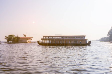 Photo for Beautiful landscape with a house boating in marine drive, Kochi, India. Travel and tourism Kerala - houseboat on Alleppey backwaters in India. Kerala houseboat image. High quality photo - Royalty Free Image