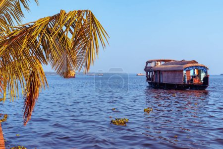 Photo for Beautiful landscape with a house boating in marine drive, Kochi, India. Travel and tourism Kerala - houseboat on Alleppey backwaters in India. Kerala houseboat image. High quality photo - Royalty Free Image