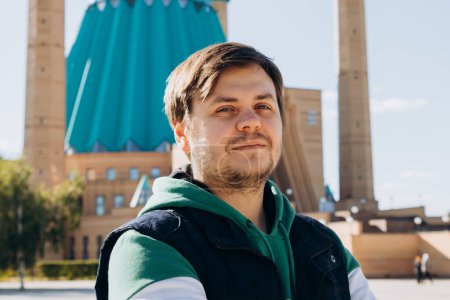 Téléchargez les photos : Young male man on Muslim Mosque. Waist up lifestyle portrait of Looking at camera man. Close-up - en image libre de droit
