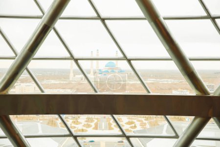 Photo for Glass window of Nur-Alem sphere in EXPO 2017 and Central  cathedral mosque. Astana Nur-Sultan, Kazakhstan - 10.24.2022. - Royalty Free Image