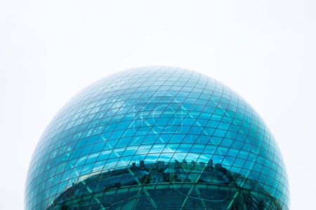 Photo for Top of round blue glass building on white sky. Round sphere modern building, Nur-Alem EXPO 2017 Exhibition Area. Museum Energy of Future. Futuristic exterior. Astana Nur-Sultan, Kazakhstan, 10.24.2022 - Royalty Free Image