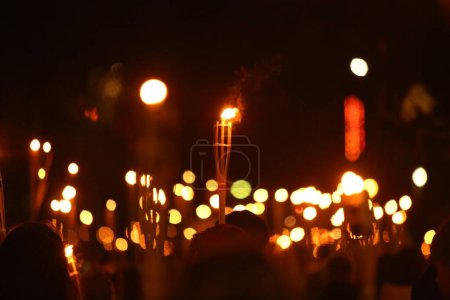 Photo for Torches at night with yellow flames and highlights - Royalty Free Image
