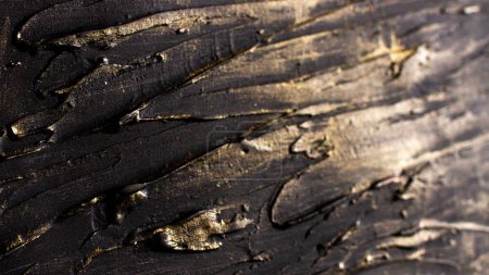 Photo for Photo-relief dark rough stripes with golden shine - Royalty Free Image