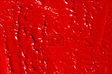Photo for The texture of lipstick, lip gloss, paint, completely filled in the background. Red color. - Royalty Free Image
