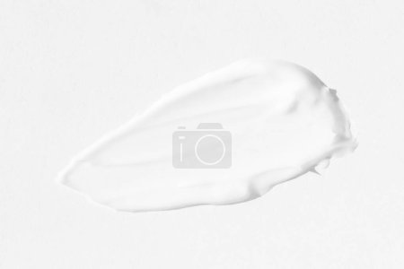 Téléchargez les photos : Grands frottis de crème cosmétique blanche. La texture de la crème close-up. - en image libre de droit