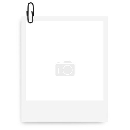 white Polaroid photo frame with a black paper clip on a blank background.