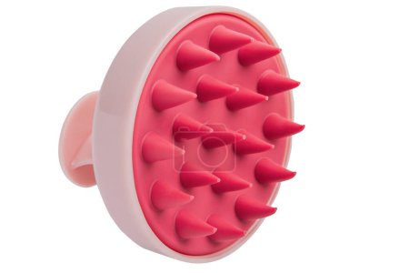 Silicone massage brush for washing hair on an empty background.