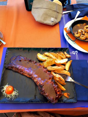 Photo for A great lunch of Pork Ribs and chips  in Fuengirola on Spain's Costa Del Sol - Royalty Free Image