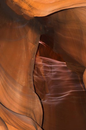 Photo for Exploring the natural wonders of Antelope Canyon, a sandstone slot canyon sculpted through eons by flash flood waters and located near Page, Arizona and Lake Powell, in Western United States. - Royalty Free Image
