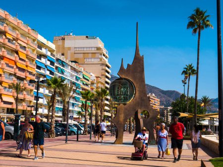 Photo for Sculpture on the promenade in Fuengirola on the Costa del Sol in Southern Spain.It was the first monument in Spain dedicated to the former Spanish currency, the peseta.The sculptor was local artist and sculptor Jose Gomez Guerrero - Royalty Free Image