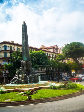 Photo for Obelisk and fountain on a traffic island in Fuengirola on the Costa Del Sol in Spain - Royalty Free Image