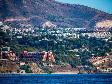 Photo for The coastline between Fuengirola and Benalmadena is filled with hotels and apartments with few breaks, having been built on to accommodate holiday makers seeking sun, sand and sea holidays - Royalty Free Image