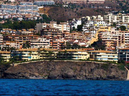 Photo for The coastline between Fuengirola and Benalmadena is filled with hotels and apartments with few breaks, having been built on to accommodate holiday makers seeking sun, sand and sea holidays - Royalty Free Image