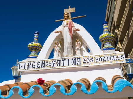 Photo for Small Shrine on the promenade in Fuengirola on the Costa del Sol to Our Lady of Fatima; known as Our Lady of the Holy Rosary of Fatima which is a Catholic title of Mary, mother of Jesus. This reminds us that the Spanish are a very religious people - Royalty Free Image