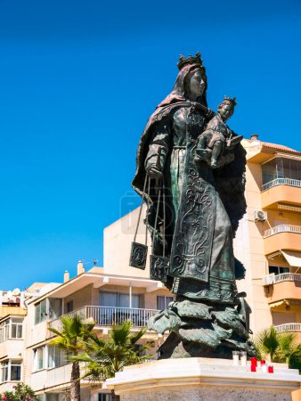 Photo for Statue of the Virgin Mary as Stella Maris (star of the Sea) with the Infant Jesus on the promenade in Fuengirola. reminds you that the Spanish are very religious people and a sea-faring nation for centuries from fishing and exploration and conquest - Royalty Free Image