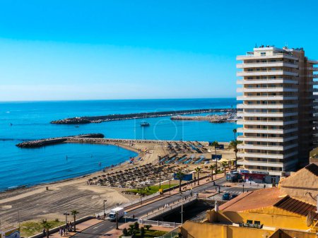 Photo for All along the Costa Del Sol in Southern Spain the sea shore is lined with luxury and high rise hotels and apartments to accommodate the millions of tourists. This is in Fuengirola which is a popular resort with a 7 kilometer beach. - Royalty Free Image