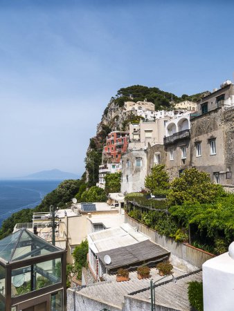 Photo for Overlooking the harbour on the island of Capri which  has been a resort island since Roman times . It is situated in the Gulf of Naples and is covered with architecture from all the successive generations - Royalty Free Image