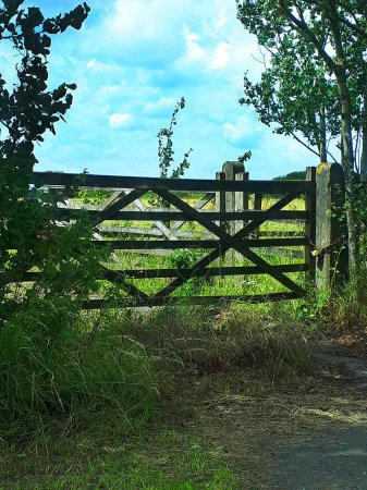Photo for Farm gate on the road from Preston the Blackpool on the Fylde Coast. The Fylde area is very flat and featureless - Royalty Free Image