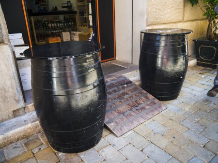 Photo for Beer Barrels outside a bar in Casemates Square o the Rock of Gibraltar.Gibraltar is a British overseas territory located near the southernmost tip of the Iberian Peninsula at the Strait of Gibraltar. This Rock lies at the tip of the mainland Spain - Royalty Free Image