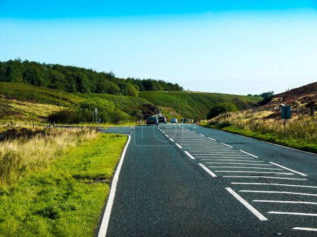 Photo for This road over Blubberhouses Moor is one of the most dangerous roads in England as it is very busy with sharp, blind bends and steep challenging climbs.However it is also very wild, romantic and beautiful - Royalty Free Image