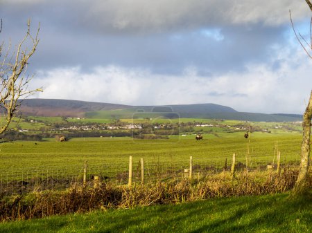 Photo for Pendle Hill in Lancashire which dominates the landscape of East Lancashire. This view was taken just two miles from the busy former Cotton Town of Burnley which is now a manufacturing centre - Royalty Free Image