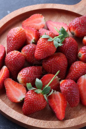 Photo for Close up of fresh strawberries on wooden board - Royalty Free Image