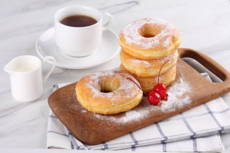 Photo for Delicious donuts on wooden board with stone background - Royalty Free Image