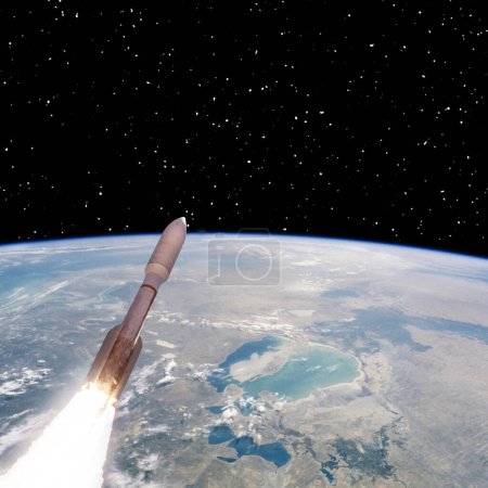 Foto de Cohete sobre la tierra. Estrellas. Concepto espacial. Los elementos de esta imagen proporcionados por la NASA - Imagen libre de derechos