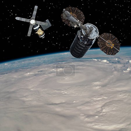 Téléchargez les photos : Des vaisseaux spatiaux au-dessus de la terre. Thème scientifique. Les éléments de cette image fournis par la NASA. - en image libre de droit