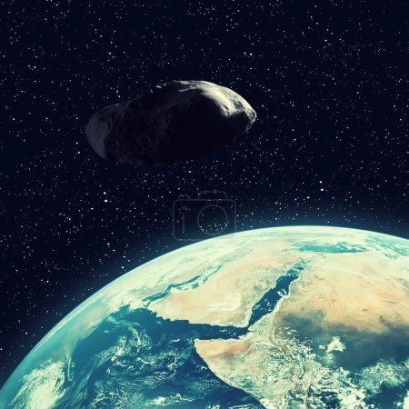 Asteroid flying above the earth. Elements of this image furnished by NASA.