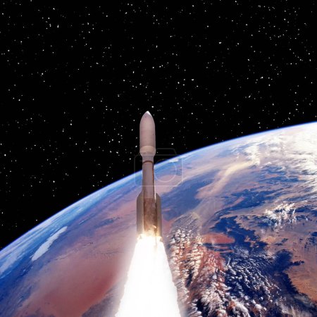 Foto de Cohete sobre la tierra. Estrellas. Concepto espacial. Los elementos de esta imagen proporcionados por la NASA - Imagen libre de derechos