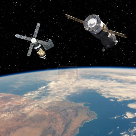 Téléchargez les photos : Des vaisseaux spatiaux au-dessus de la terre. Thème scientifique. Les éléments de cette image fournis par la NASA. - en image libre de droit