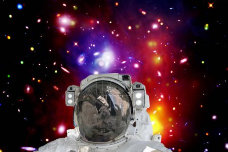 Photo for Astronaut and galaxy on the backdrop. The elements of this image furnished by NASA - Royalty Free Image