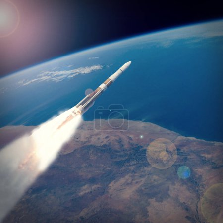 Téléchargez les photos : Une fusée au-dessus de la terre. Les éléments de cette image fournis par la NASA - en image libre de droit