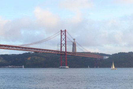 View of 25th of April Bridge in Lisbon, Portugal. Tagus river.