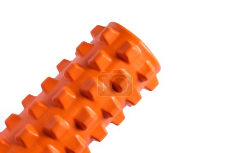 Photo for An orange massage foam roller and isolated on a white background. Close-up. Foam rolling is a self myofascial release technique. Concept of fitness equipment. - Royalty Free Image