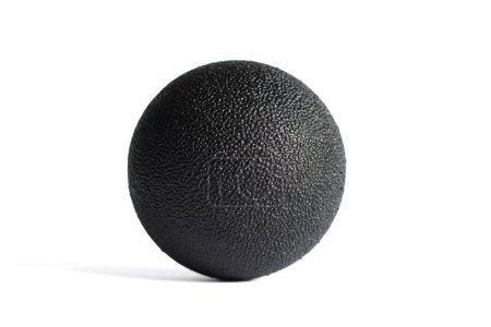 Massage black ball for trigger points isolated on a white background. Concept of myofascial release.