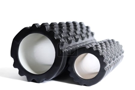 Photo for The black foam massage rollers isolated on a white background. Foam rolling is a self myofascial release technique. Gym fitness equipment. - Royalty Free Image