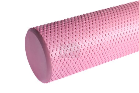 A pink massage foam roller isolated on a white background. Close-up. Foam rolling is a self myofascial release technique. Concept of fitness equipment.