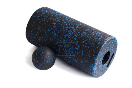 Photo for Massage set: A black blue foam roller and mfr massage ball isolated on a white background. Close-up. Foam rolling is a self myofascial release technique. Concept of fitness equipment. - Royalty Free Image